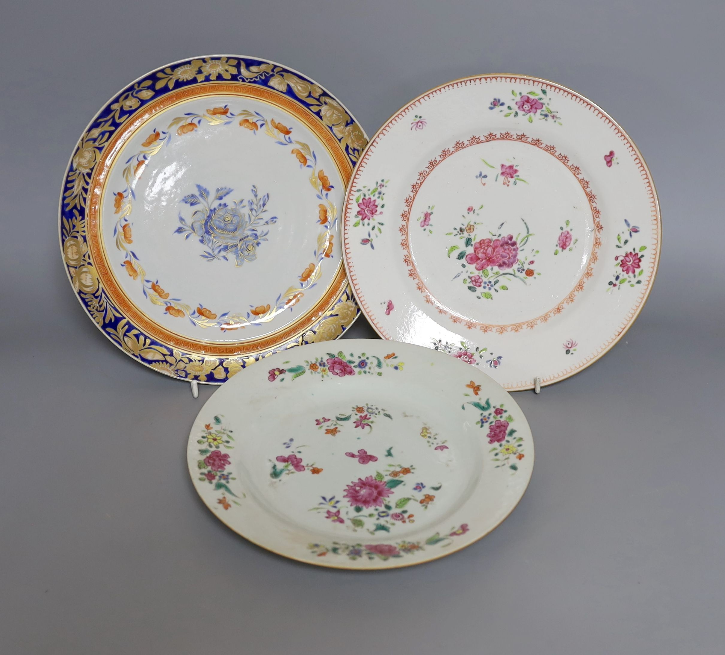 An early 19th century Chinese enamelled porcelain plate and two 18th-century Chinese export famille rose plates (3) largest 24.5cm diameter